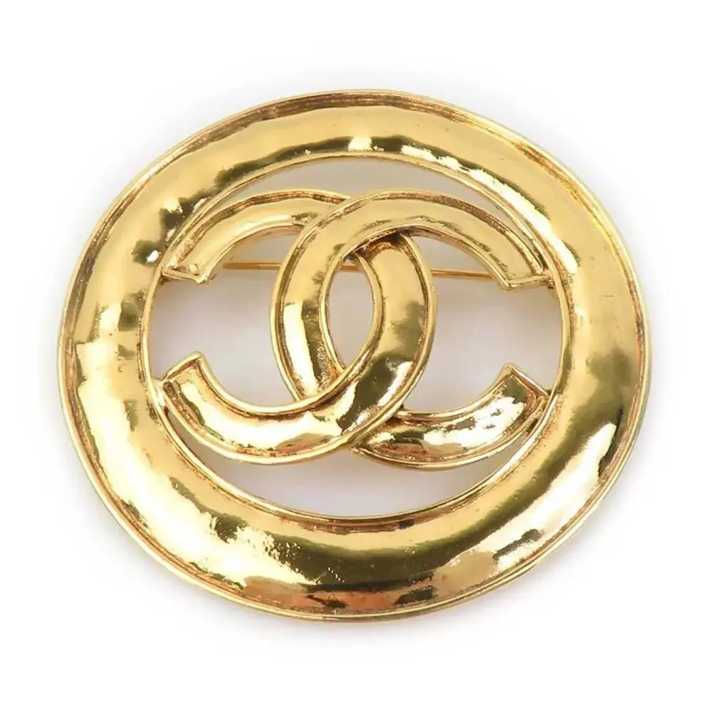 CHANEL Gold Logo Brooch